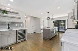 Wet bar with a wine refrigerator.