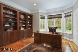 Custom Built-in Cabinets, French Doors, Hardwood Floors with Inlay Design