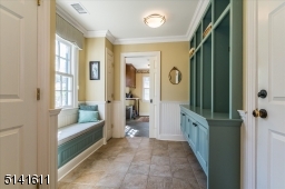 Window bench and cubbies with entrance from garage