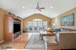 This room is a WOW! soaring ceilings, huge windows that overlook the backyard.