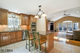 Maple cabinetry, top of the line Kitchen Aid appliances and granite counter tops.
