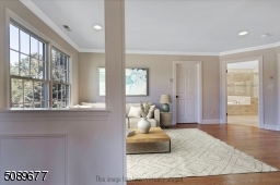 Enjoy this tranquil sitting room in the main suite. Perfect place to read a book or for a second office.