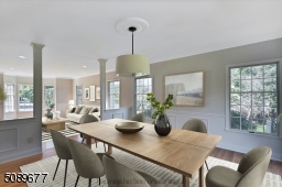 There are tasteful columns distinguishing the two entertaining spaces of the living room and dining room.