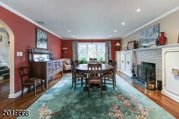 Spacious Living Room With Fireplace Currently Used As A Dining Room