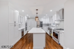 The custom designed kitchen is a gourmet chef's dream with beautiful central island breakfast bar.
