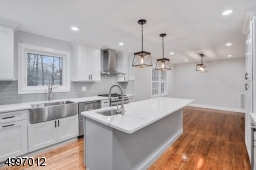 You will love the two sinks in the kitchen. 36" stainless steel farmers sink & island sink. In addition to the natural light the kitchen is brightened by Antique Bronze Briarwood Collection pendant lighting.