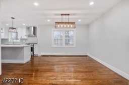 Formal dining room is spacious & bright as the large new windows allow natural lights to flow from every corner