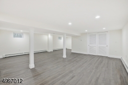 Finished full basement featuring recreation room with additional storage room & possible home office. Added amenities include vinyl plank flooring, recessed lighting