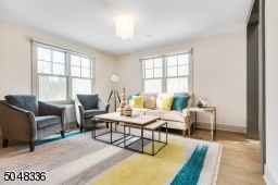 Chic "greige" hardwood floors throughout set the tone for this tremendous home.