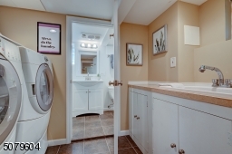 Laundry Room leads to lovely Full Bath