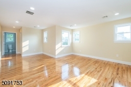 Large master bedroom that has walk in closet along with private bathroom.