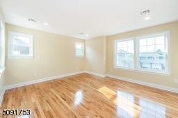 Large master bedroom that has walk in closet along with private bathroom.