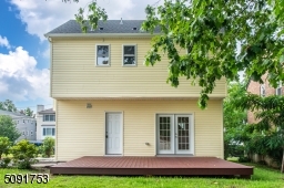 Rear view of the property with new 300 sq foot deck for entertaining and relaxing.
