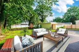 Rear view of the property with new 300 sq foot deck for entertaining and relaxing.