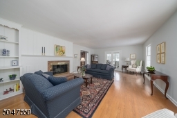 Living Room with built ins and wood burning fireplace