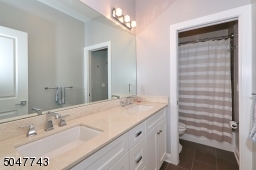 Shower over tub and double sink vanity