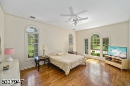 Bedroom in front of house with handicapped tub in closet area.