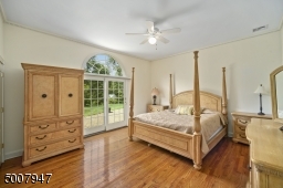 Bedroom with fabulous views of backyard and pond.