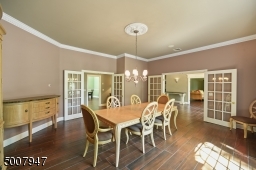 Dining room with 2 sets of French doors.