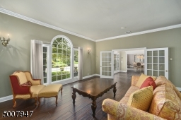 Large living room overlooking front yard.
