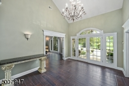 Enter through the beautiful glass front doors into a large foyer.