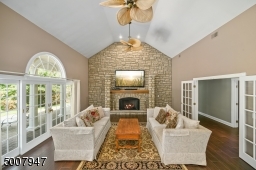 Family room with floor to ceiling stone gas fireplace