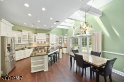 Kitchen with 3 ovens, plenty of counter space for cooking.