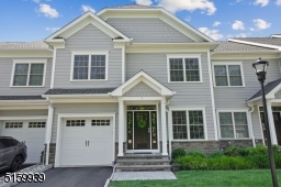 Covered front entry. Front door with a transom window and sidelights