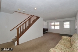 Exit to Covered Porch, Garage and Utility Room
