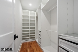 This master closet has it all... ample double hang space, 8 deep drawers, pullout jewelry trays topped with glass shelves, 2 shoe towers and extra storage shelves.