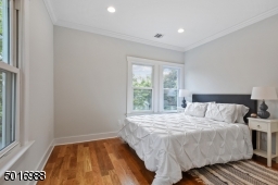 This spacious front bedroom gets the most sparkling natural light!