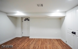 This finished basement features luxury vinyl plank flooring, two bonus rooms, storage closets and the utilities with a Bilco walk-out to the patio