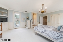Large walk-in closet, master bath, door to private deck