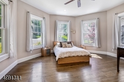 Tucked into the turret's first level, this 5th bedroom is accompanied by a walk-in custom closet and full bath.