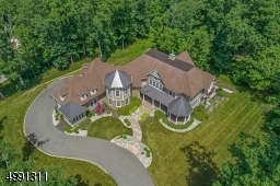 Poised on a cul-de-sac of distinguished homes, the driveway swirls past the lushly landscaped entry to arrive at the 4-car garage. Control4 Smart Home Automation offers extensive possibilities for managing security, entertainment, lighting, etc.