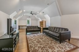 This 31 x 14-ft. space is a finished area over the 4-car garage. Features include dormer windows, hardwood flooring, recessed lighting, ceiling fan. Also, a separate office/den area with storage.