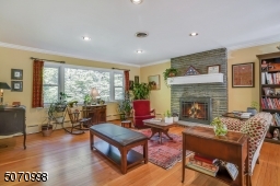 Cozy living room with a wood burning fireplace.