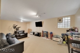 The lower level offers a playroom on one side and finished game room on the other.   Additional unfinished space is also available for storage.