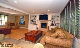 Gleaming Wood Floors on Both First Floor & Second Floor, Built ins, Gas fireplace, Surround sound system & Recessed Lighting.