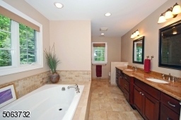 including Bench & multiple shower accessories. Soaking Tub. Double Sink Vanity.