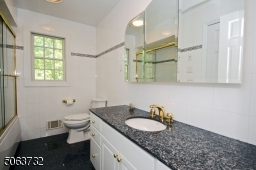 Granite Counter-top & Triple Mirror.