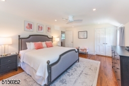 Spacious room with recessed lights, ceiling fan and access to the walk-up attic through the closet