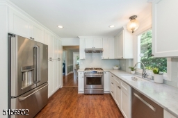 Water/ice dispenser on the refrigerator and tall pantry shelving with drawers that pull out.