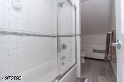 Brand new with shower over tub and white subway tile