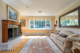 Light pours into this house.....Living Room has wood burning fireplace