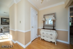 Sun drenched foyer welcomes you into this beautiful hom