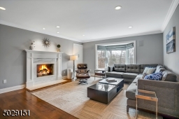 Very cool room! fabulous marble fireplace, built-in cabinetry (can you see it?) large windows and hardwood flooring.  Nothing is missing!