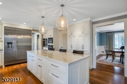 Totally gutted kitchen that was re-created.  Miele 18" freezer with water and ice, and a 36" Miele refrigerator. Don't forget the Calcutta oversized marble center island.