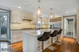 Custom insert doors on shaker cabinets, Classic! Wolfe cooktop with Vent-a-hood velocity vent.