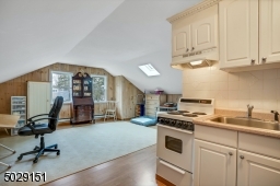 How great is this! a studio with kitchen and half bathroom. Access through the laundry room.